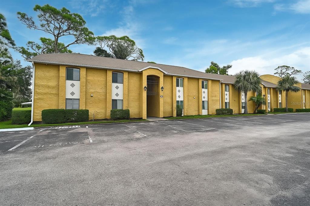1737 Parakeet Way, Unit 611 Sarasota, FL 34232 - Photo 1 of 1 a front view of a house with a yard