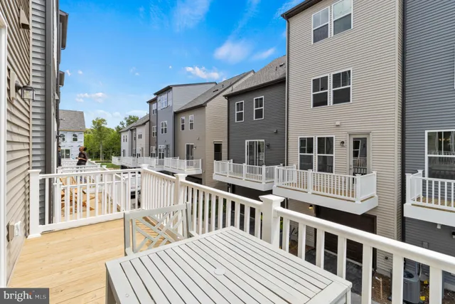 a view of a house with wooden deck