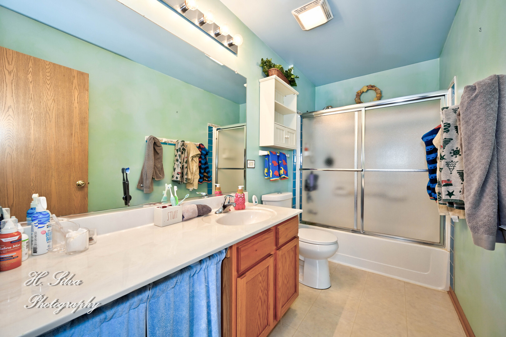 602 Spring Drive Marengo, IL 60152 - Photo 17 of 25 a bathroom with a sink vanity mirror and toilet