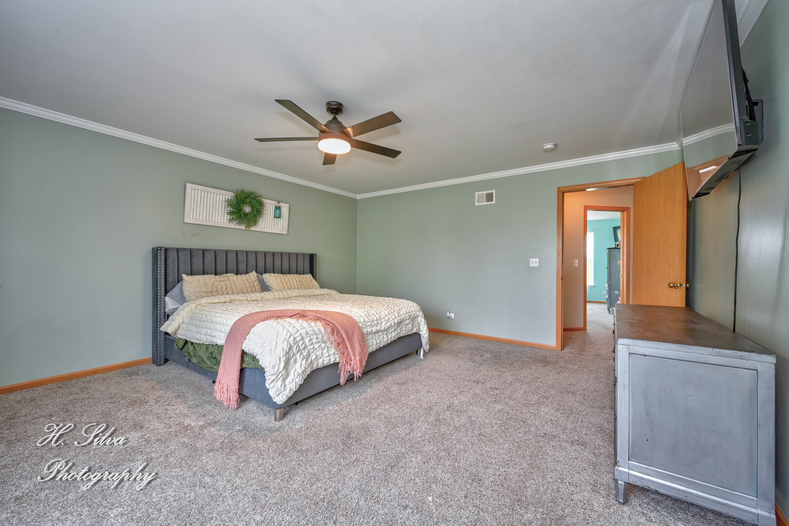 602 Spring Drive Marengo, IL 60152 - Photo 9 of 25 a bed room with a bed and a chandelier