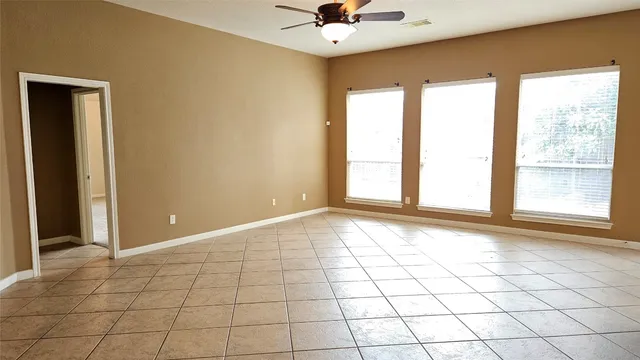 a view of an empty room and window