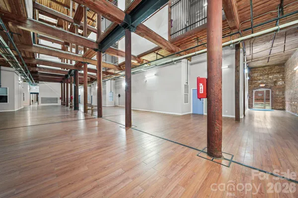 a view of an entryway with wooden floors