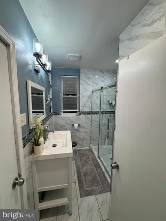 a kitchen with refrigerator and furniture