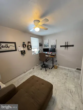 a workspace with furniture and window
