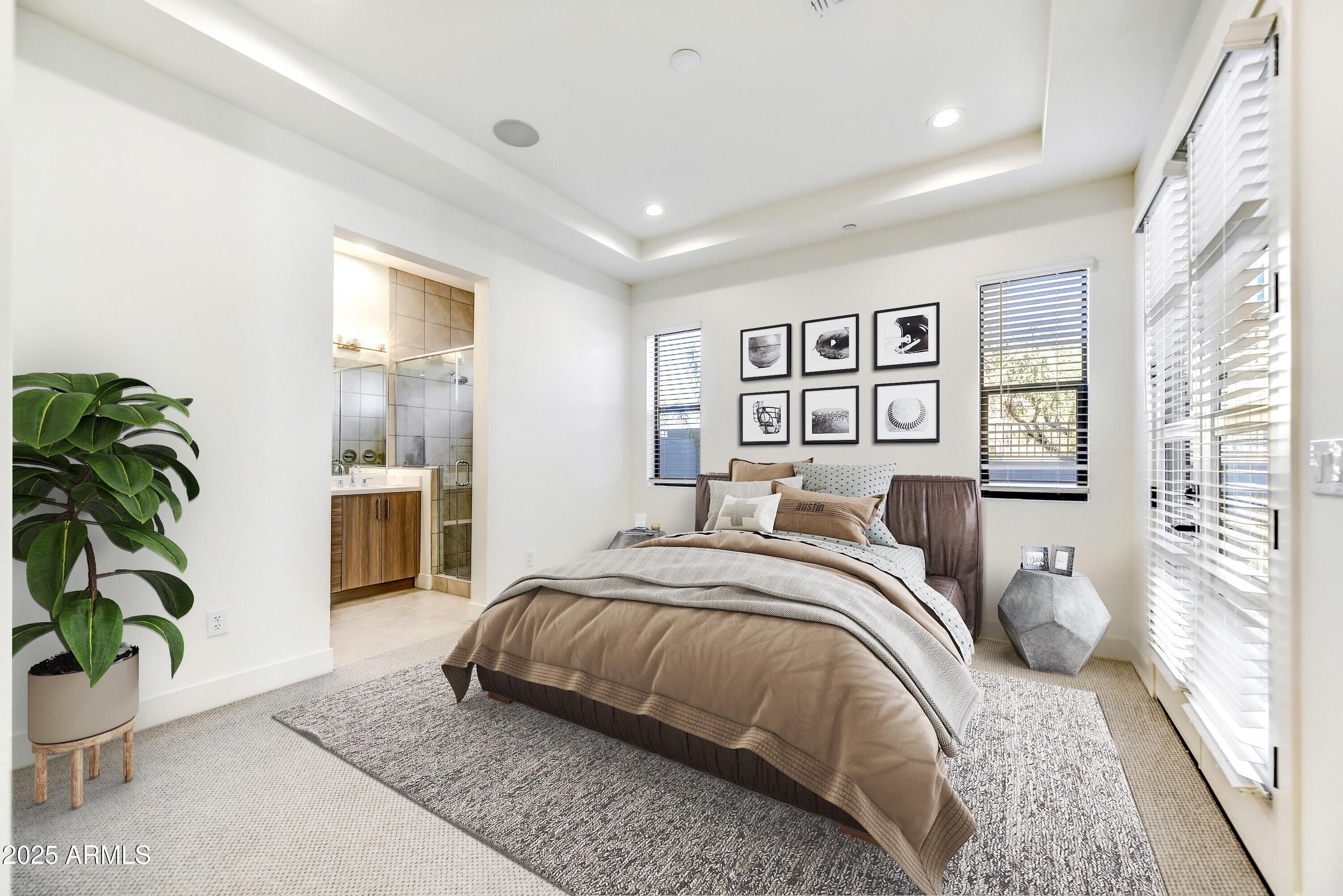 1 Easy Street, Unit 12 Carefree, AZ 85377 - Photo 14 of 43 a spacious bedroom with a bed and a couch