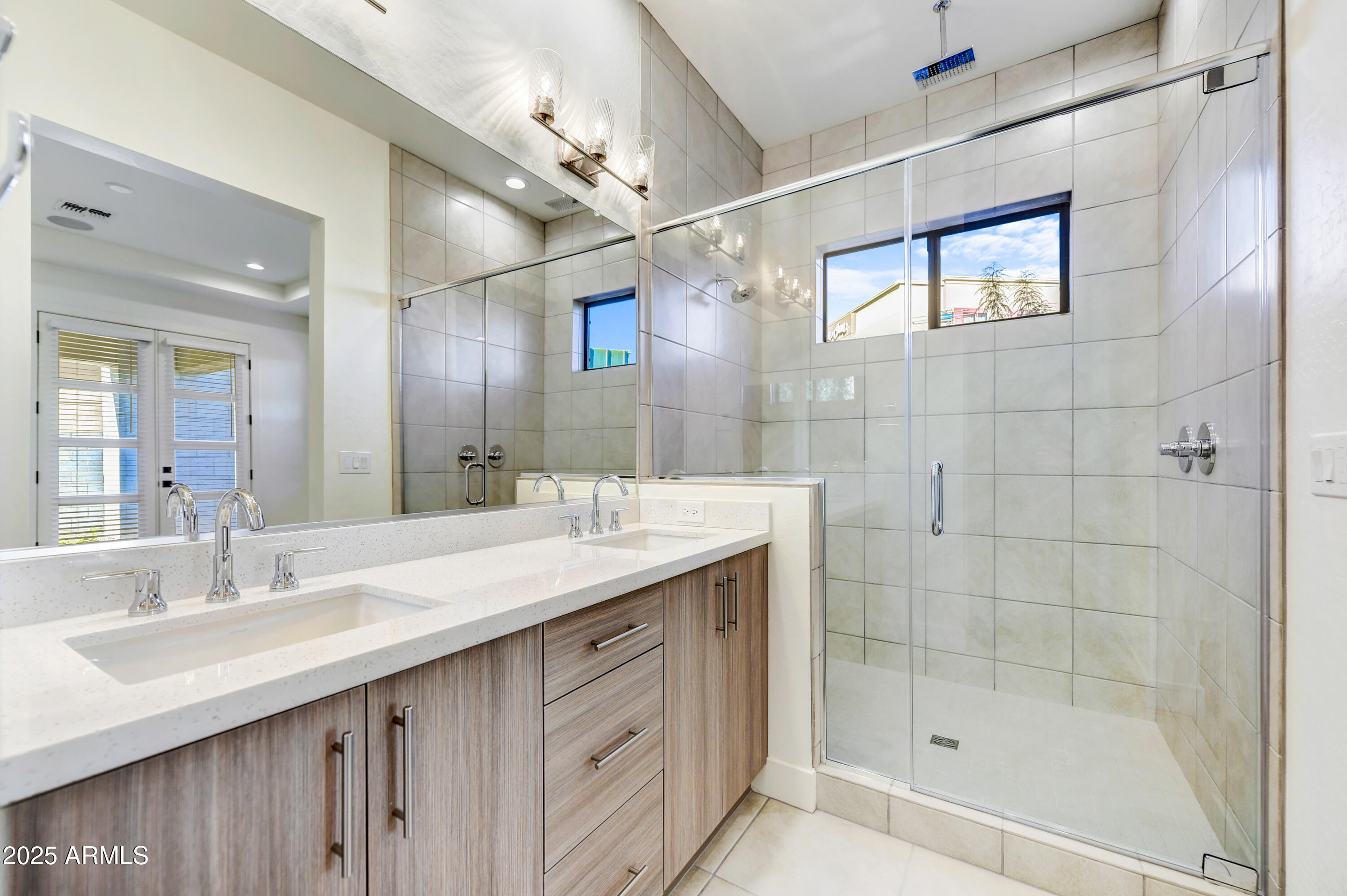 1 Easy Street, Unit 12 Carefree, AZ 85377 - Photo 16 of 43 a bathroom with a double vanity sink mirror and shower