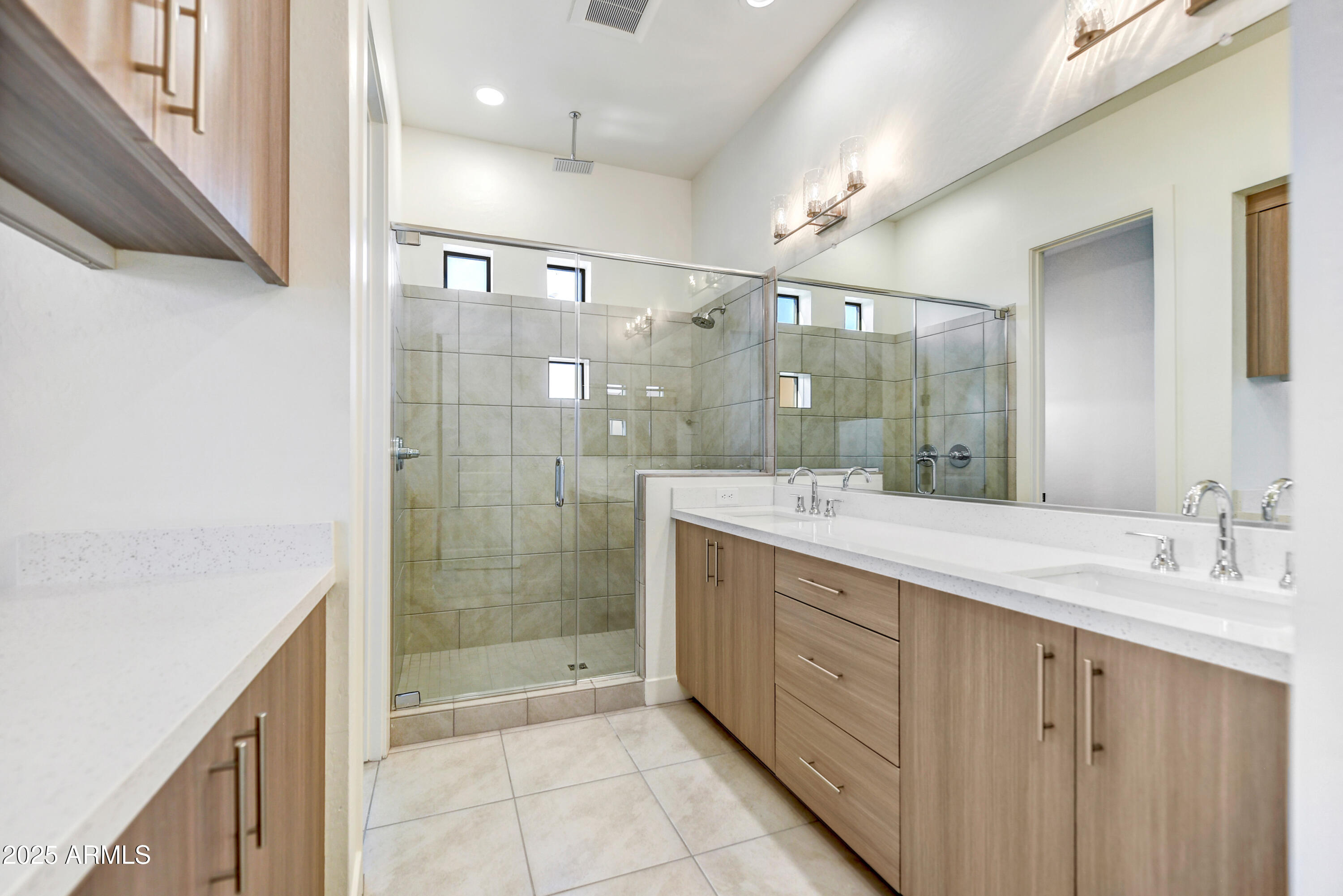 1 Easy Street, Unit 12 Carefree, AZ 85377 - Photo 20 of 43 a bathroom with a shower sink and mirror