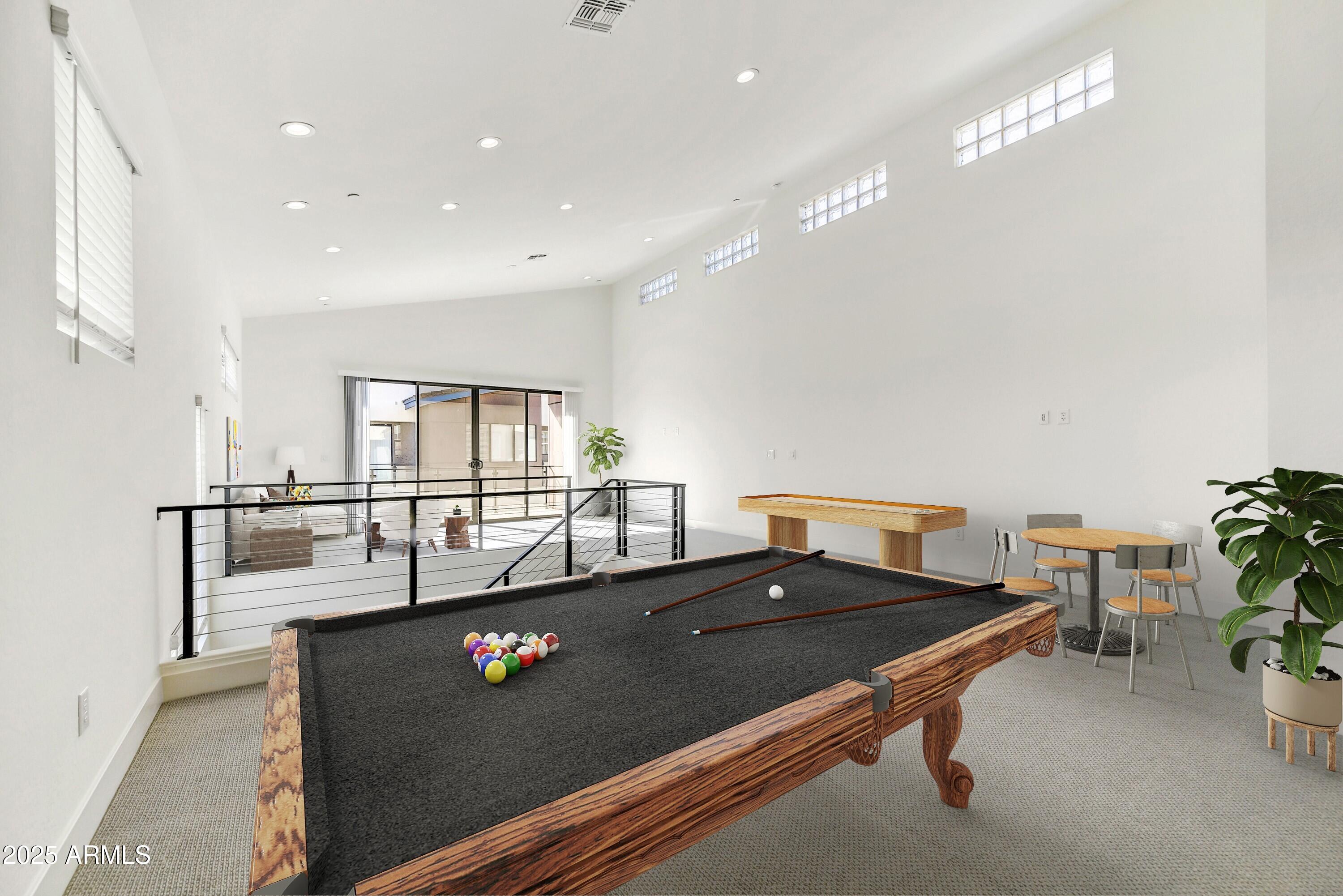 1 Easy Street, Unit 12 Carefree, AZ 85377 - Photo 22 of 43 a living room with furniture pool table and blue walls