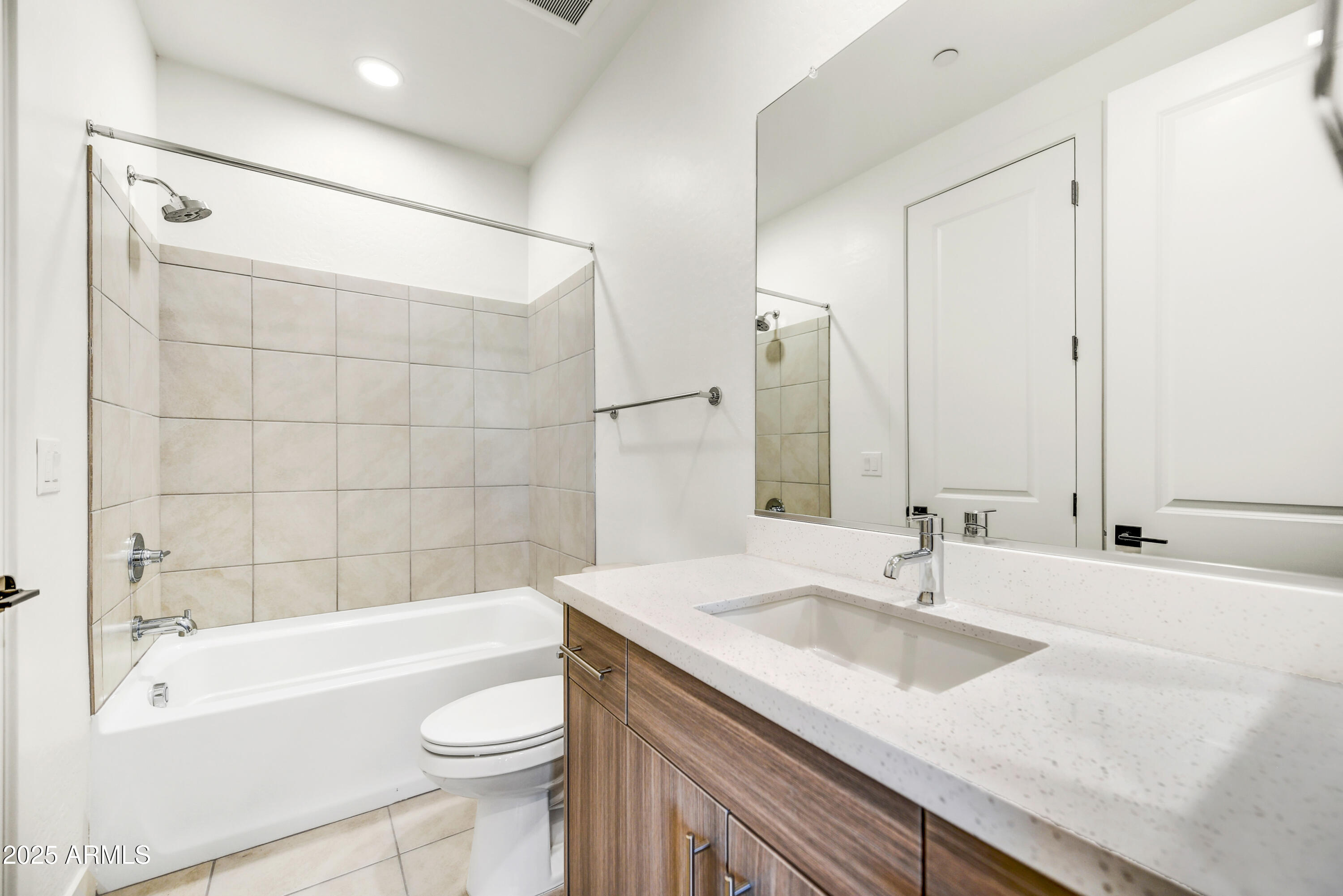1 Easy Street, Unit 12 Carefree, AZ 85377 - Photo 27 of 43 a bathroom with a granite countertop sink mirror toilet and bathtub