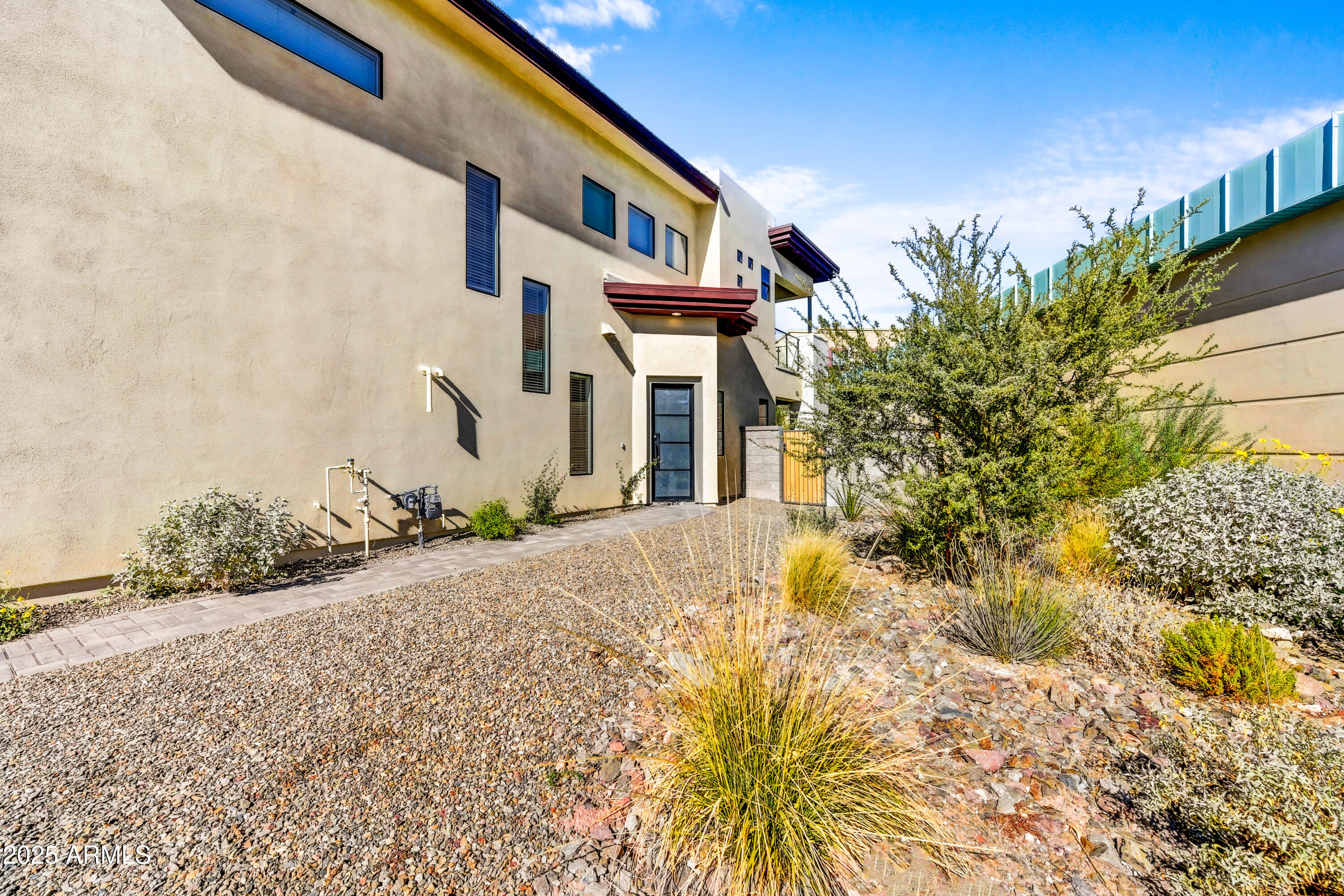 1 Easy Street, Unit 12 Carefree, AZ 85377 - Photo 3 of 43 a front view of a house with a yard