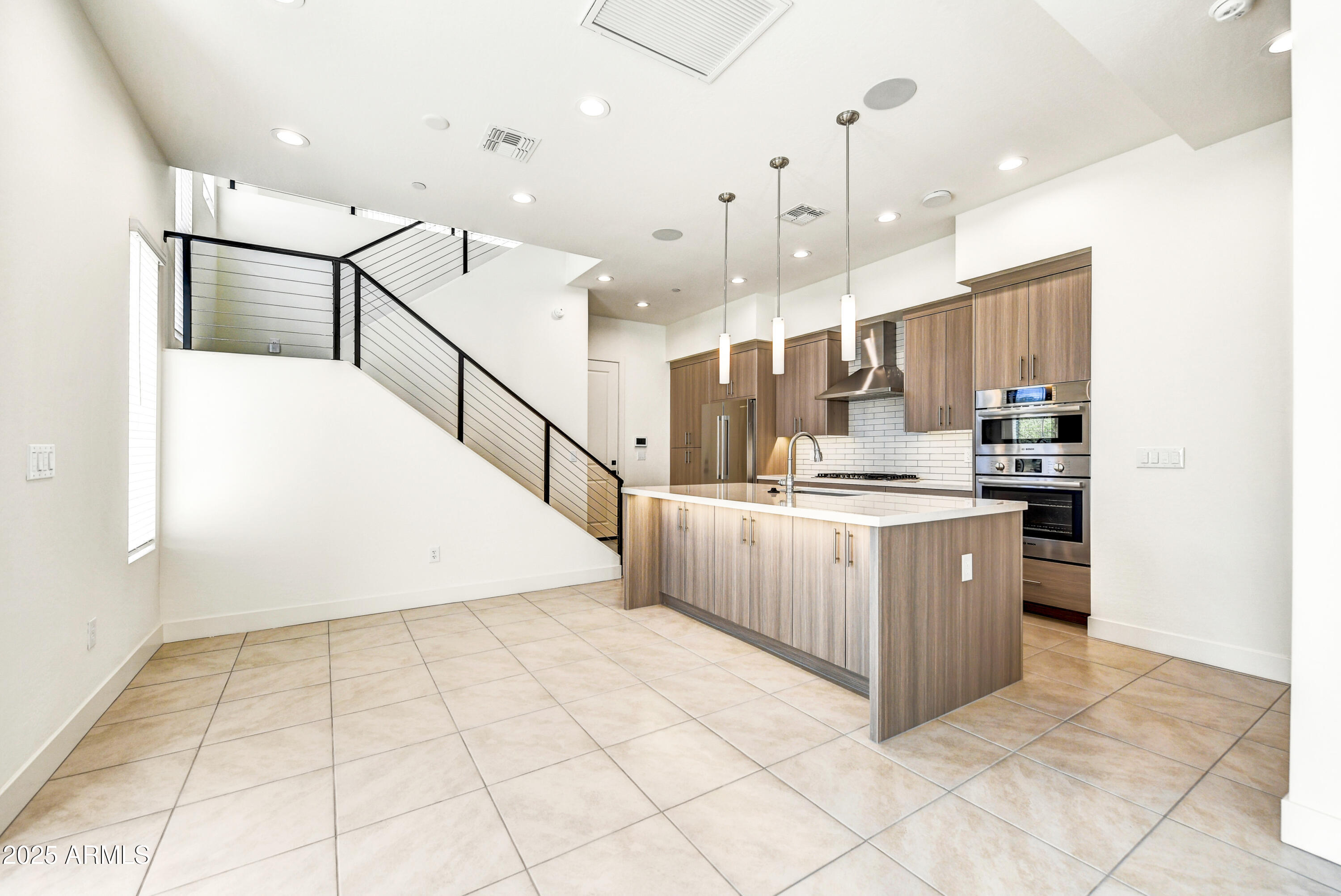 1 Easy Street, Unit 12 Carefree, AZ 85377 - Photo 6 of 43 a kitchen with kitchen island cabinets and window
