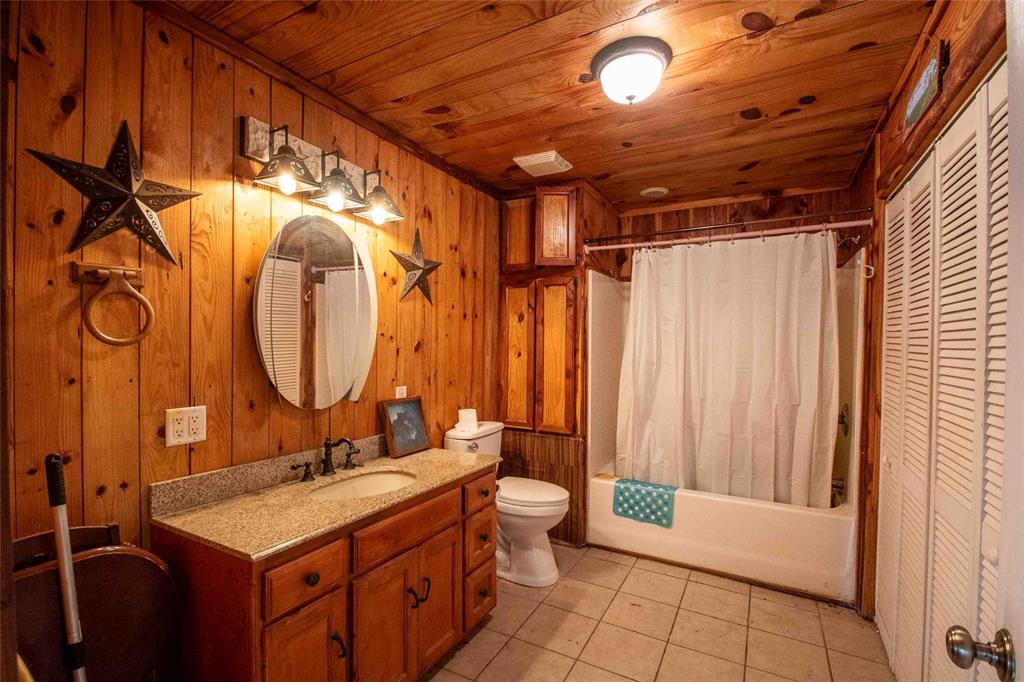 3389 Pvt Road Van, TX 75790 - Photo 15 of 31 a bathroom with a double vanity sink mirror and toilet