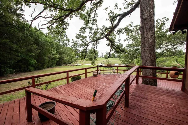 a view of balcony with wooden floor and seating space