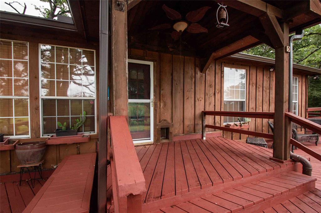 3389 Pvt Road Van, TX 75790 - Photo 20 of 31 a view of balcony with wooden floor and seating space