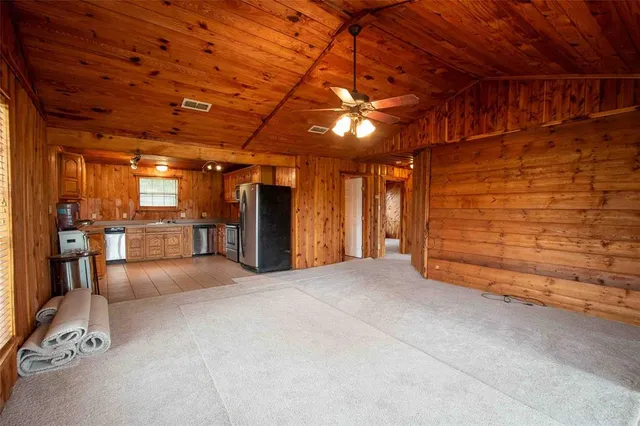 a view of an empty room with a bathroom