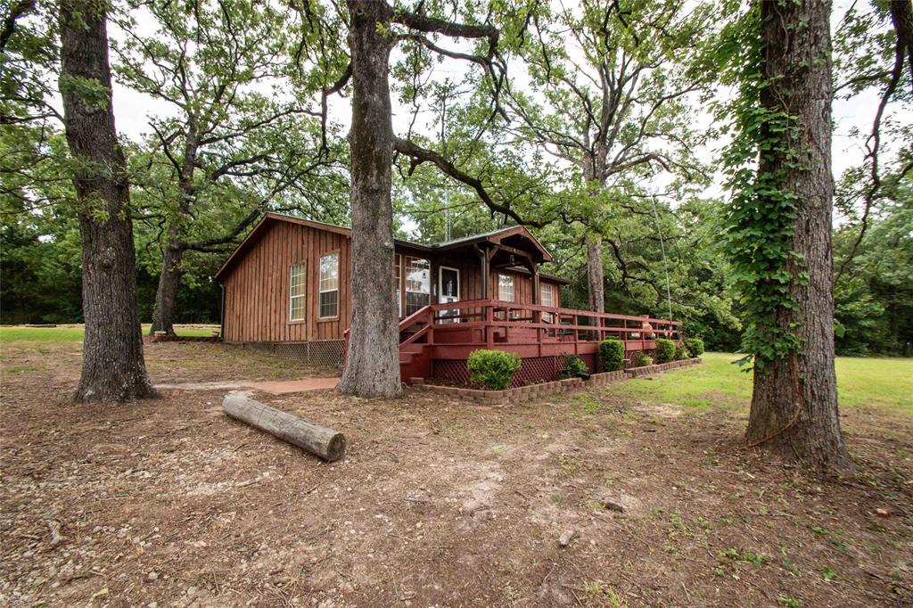 3389 Pvt Road Van, TX 75790 - Photo 21 of 31 a view of a house with backyard and trees