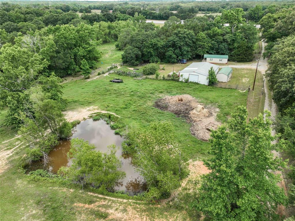 3389 Pvt Road Van, TX 75790 - Photo 27 of 31 a view of a garden with a lake