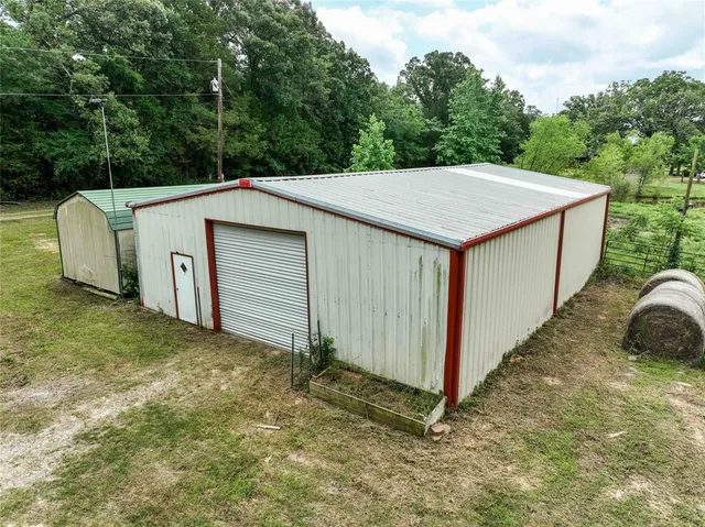 an aerial view of a house with yard swimming pool and outdoor seating