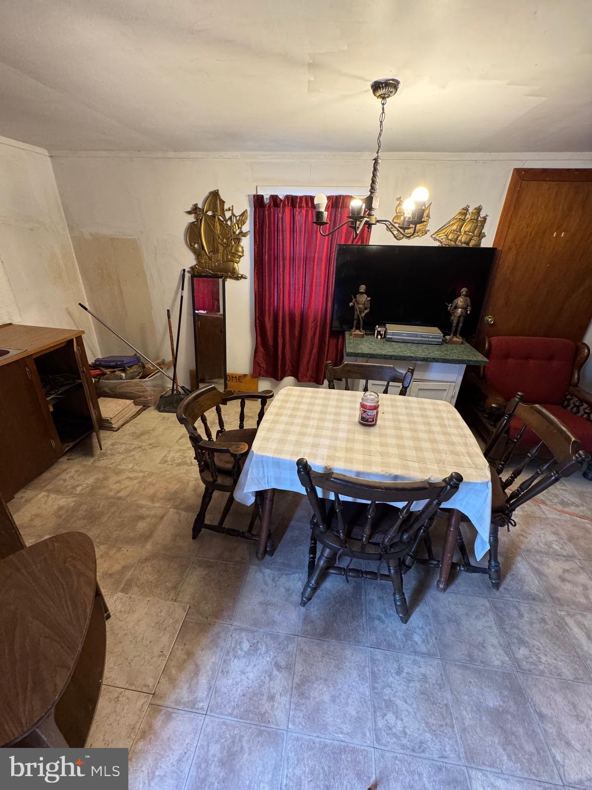 362 Oak Hill Road Moorefield, WV 26836 - Photo 111 of 132 a living room with furniture a flat screen tv and a table