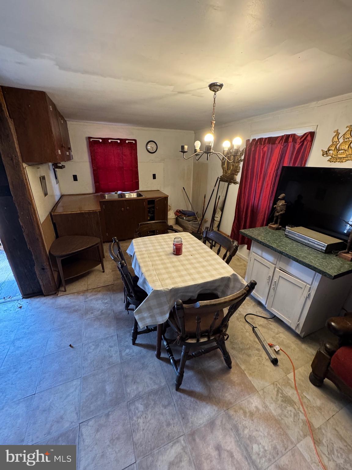 362 Oak Hill Road Moorefield, WV 26836 - Photo 112 of 132 a living room with furniture a flat screen tv and a dining table