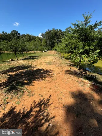 a view of a lake with a yard