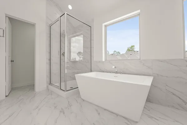 a bath tub sitting next to a white sink
