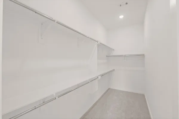 a view of an empty walk in closet