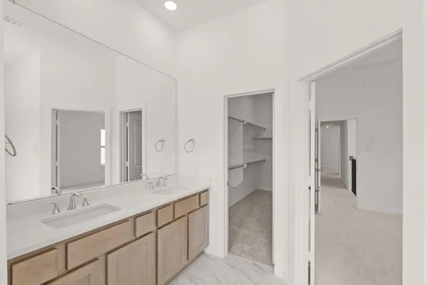 a bathroom with a shower sink and mirror