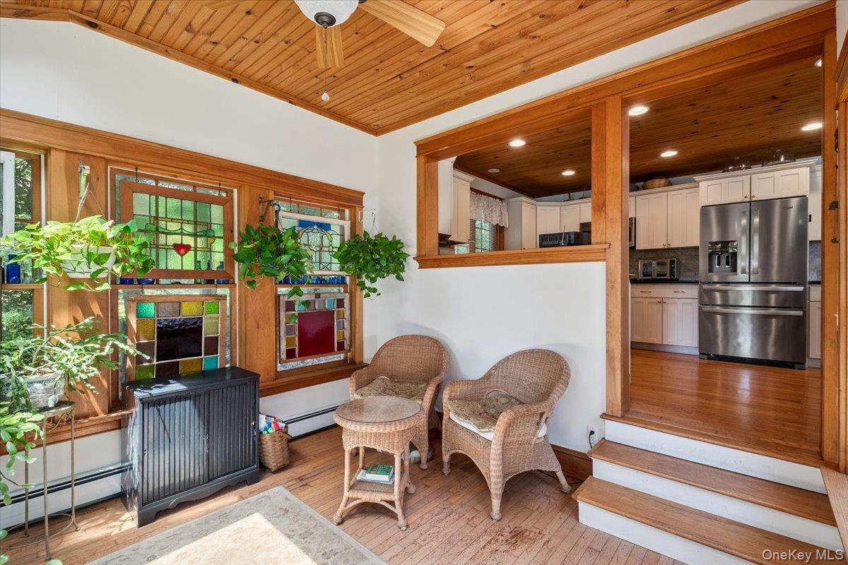 342 Lake Shore Road Putnam Valley, NY 10579 - Photo 17 of 46 Sitting room featuring wooden ceiling, hardwood / wood-style flooring, baseboard heating, ceiling fan, and plenty of natural light
