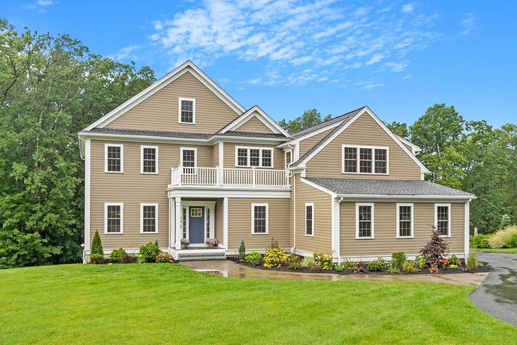 64 Mill Pond Road Bolton, MA 01740 - Photo 1 of 41 a front view of a house with a yard