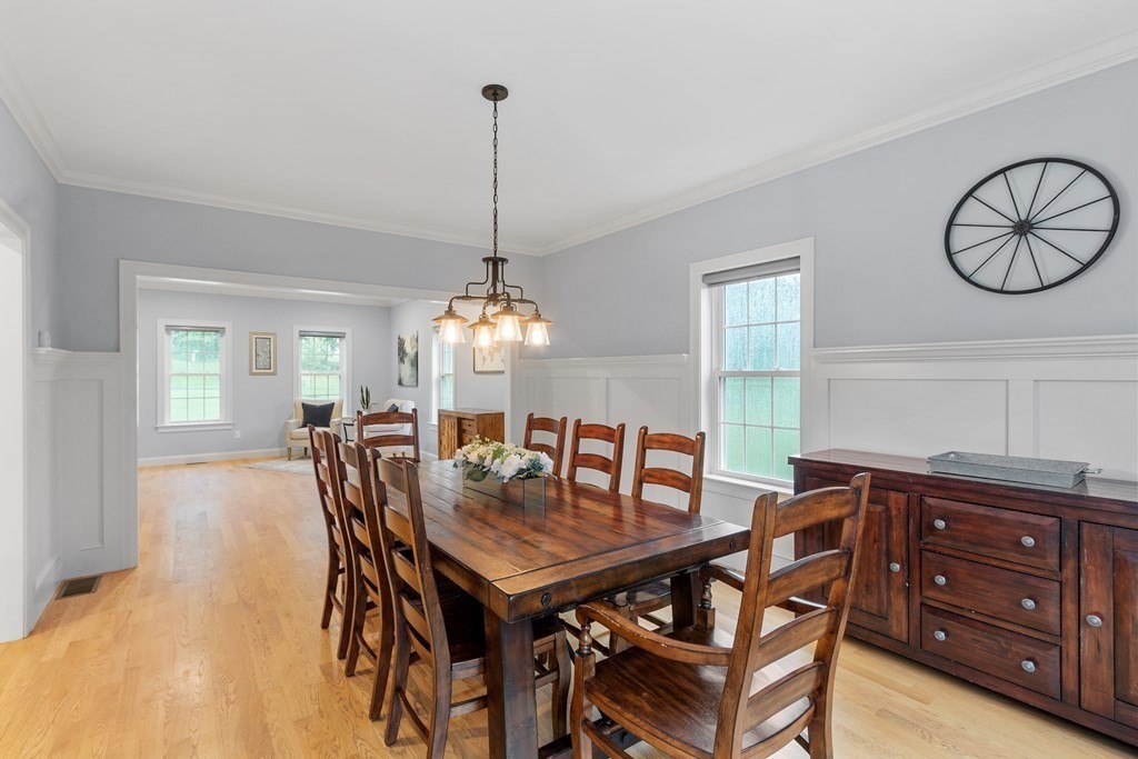 64 Mill Pond Road Bolton, MA 01740 - Photo 11 of 41 a view of a dining room and chandelier