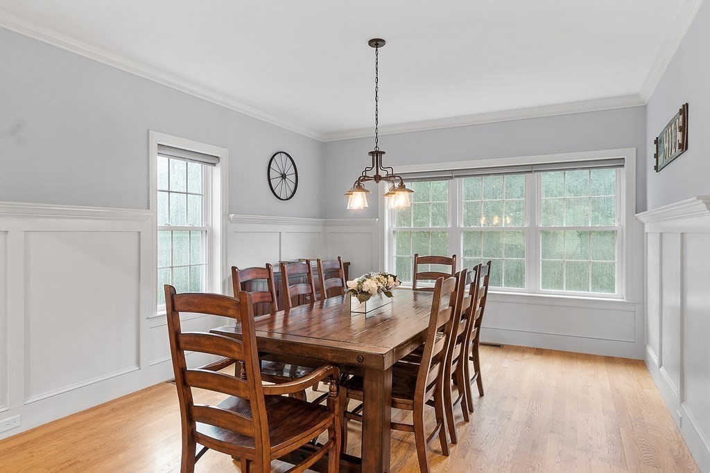 64 Mill Pond Road Bolton, MA 01740 - Photo 12 of 41 a view of a dining room with furniture window and wooden floor