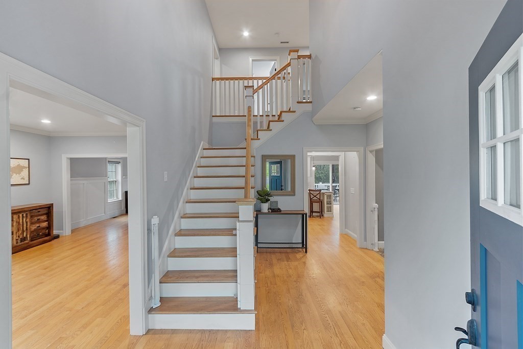 64 Mill Pond Road Bolton, MA 01740 - Photo 18 of 41 a view of entryway and hall with wooden floor