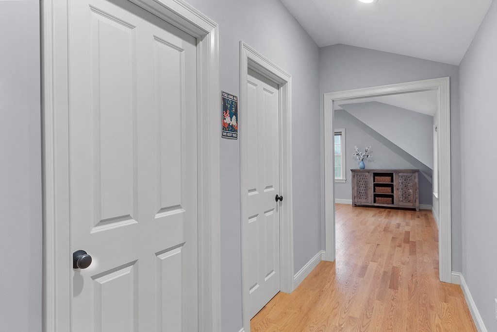 64 Mill Pond Road Bolton, MA 01740 - Photo 19 of 41 a hallway with wooden floor and front door