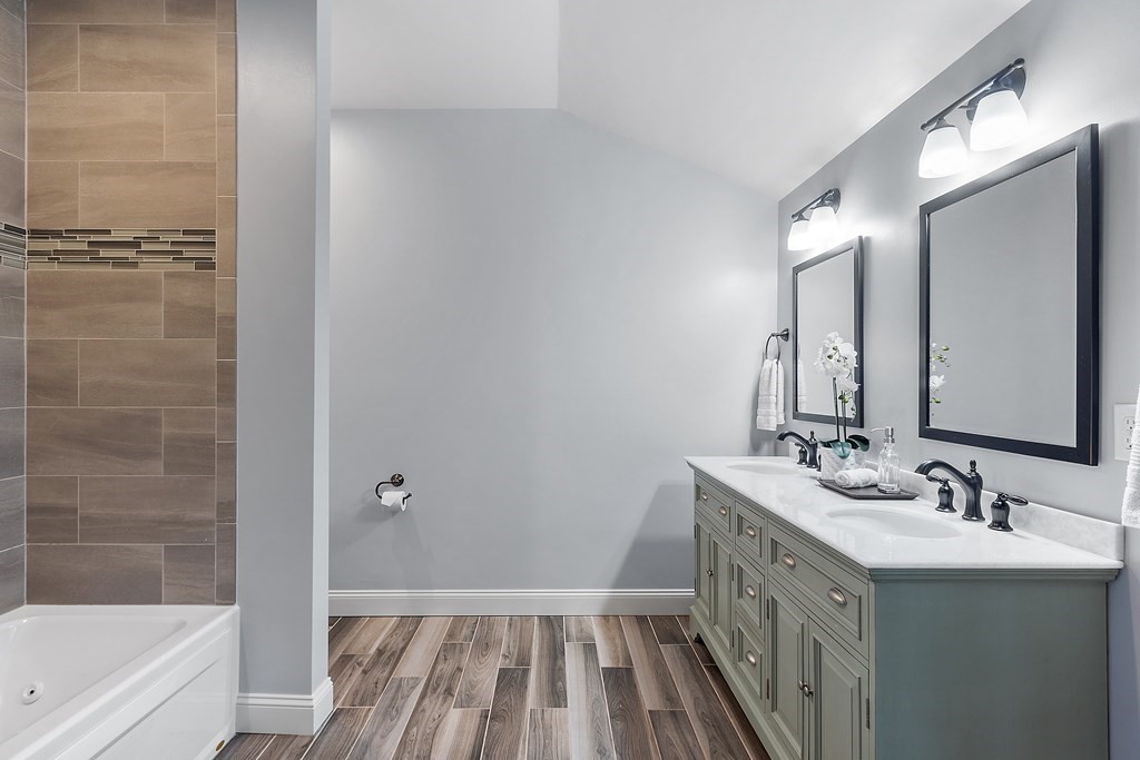 64 Mill Pond Road Bolton, MA 01740 - Photo 25 of 41 a bathroom with a sink a mirror and a bathtub