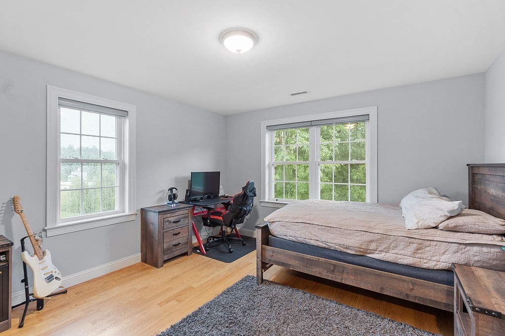 64 Mill Pond Road Bolton, MA 01740 - Photo 26 of 41 a bedroom with a bed chair and a window