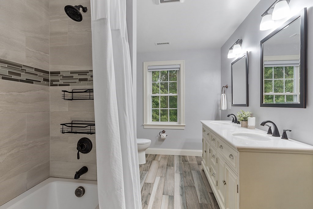 64 Mill Pond Road Bolton, MA 01740 - Photo 29 of 41 a bathroom with a sink a tub and a mirror