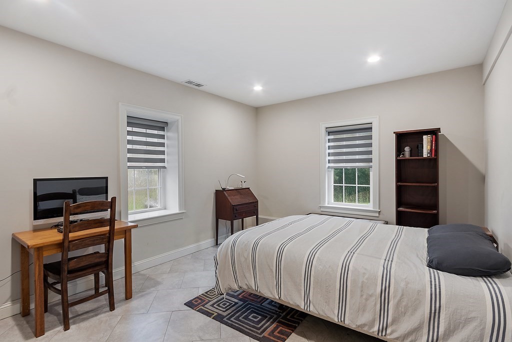 64 Mill Pond Road Bolton, MA 01740 - Photo 33 of 41 a bedroom with a bed and a desk