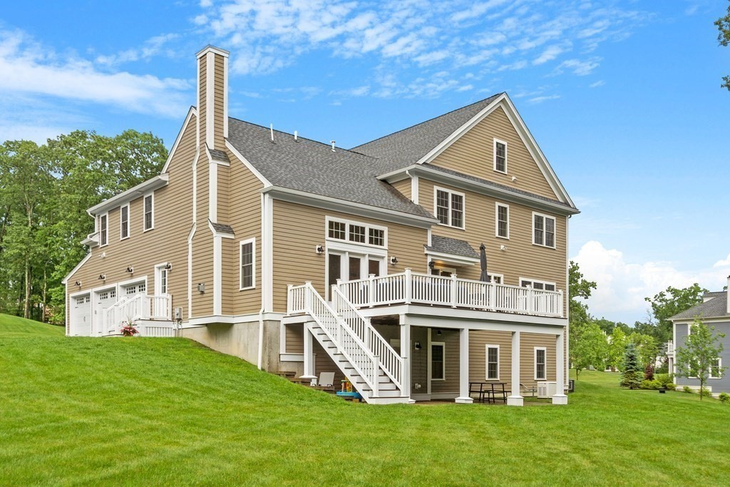 64 Mill Pond Road Bolton, MA 01740 - Photo 36 of 41 a front view of a house with a garden