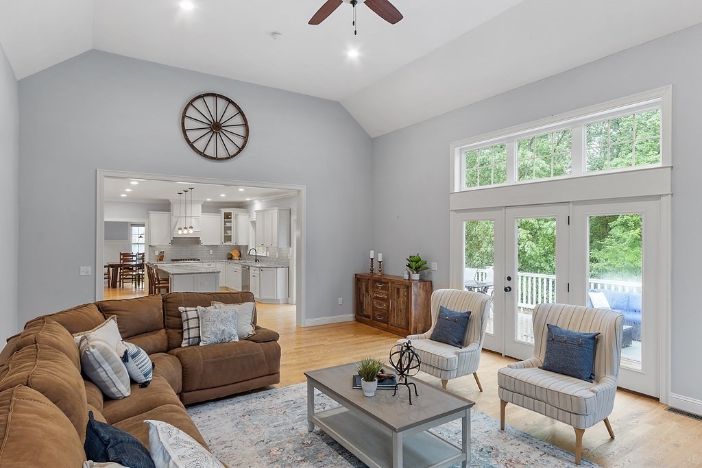 64 Mill Pond Road Bolton, MA 01740 - Photo 9 of 41 a living room with furniture a table and a large window
