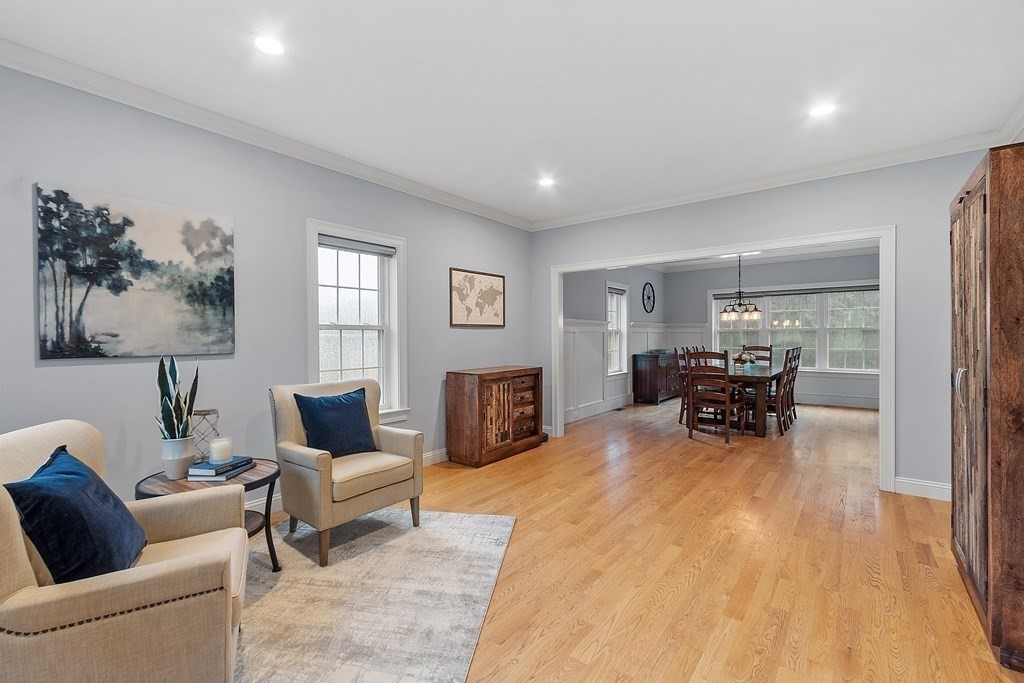 64 Mill Pond Road Bolton, MA 01740 - Photo 10 of 41 a living room with furniture and a table with wooden floor