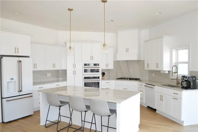 a view of a room with furniture and wooden floor
