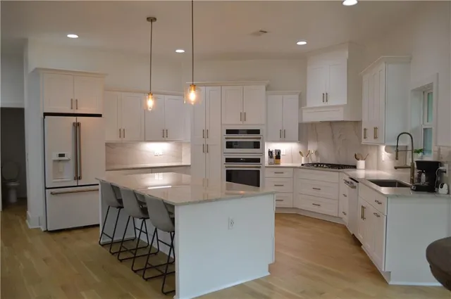 a view of a deck with table and chairs with wooden floor and fence