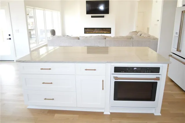 a view of balcony with wooden floor