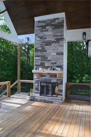 a large bed sitting in a bedroom next to a window