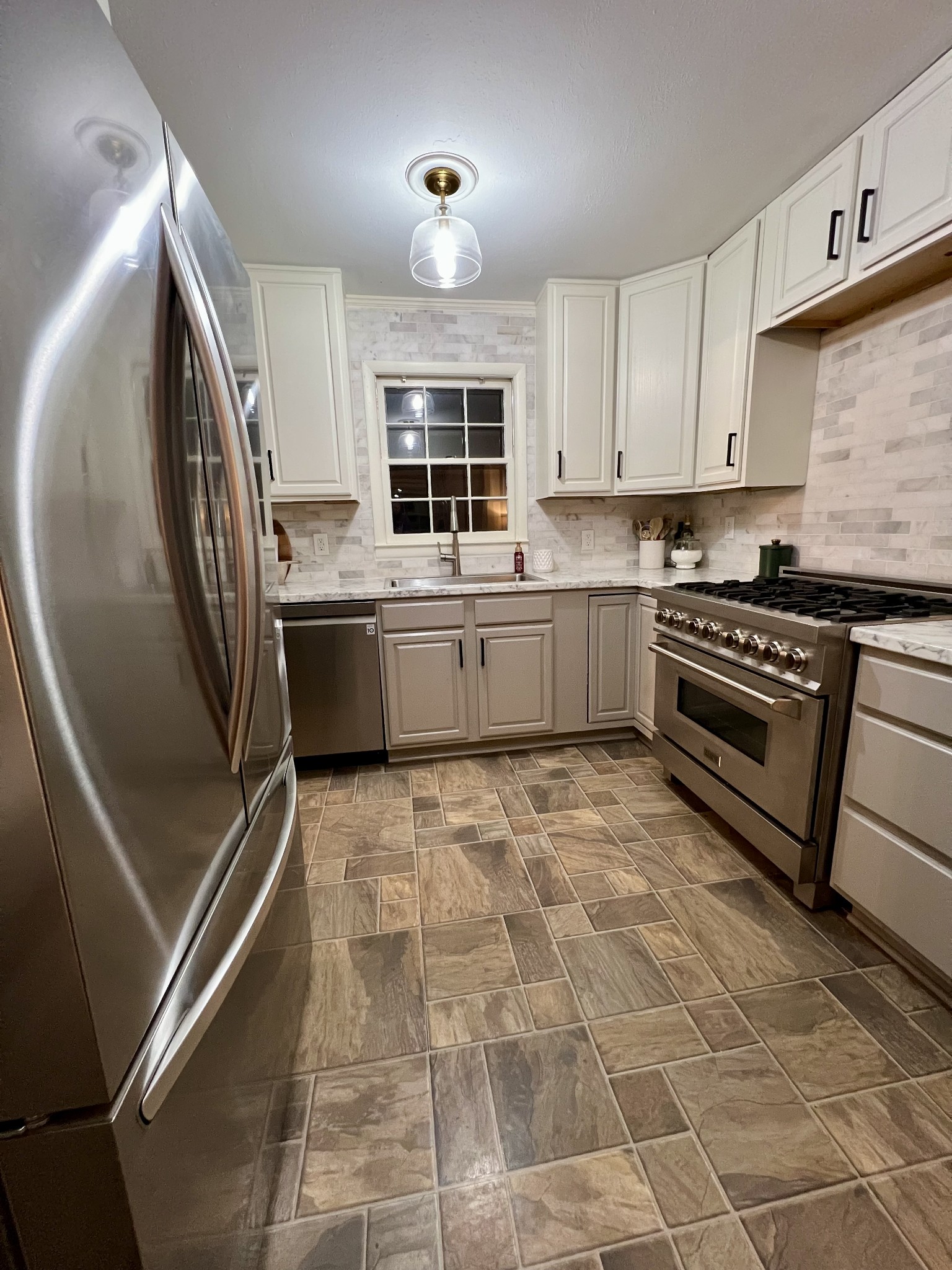 289 Patrick Road Fayetteville, TN 37334 - Photo 7 of 20 a kitchen with stainless steel appliances granite countertop a sink stove and cabinets