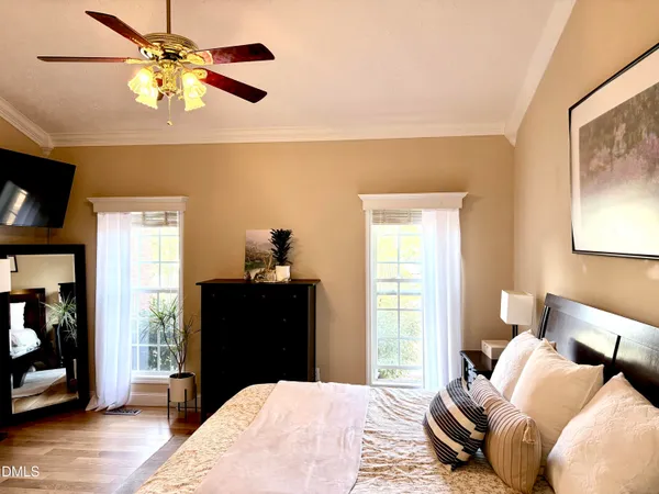 a bedroom with a large bed and a window