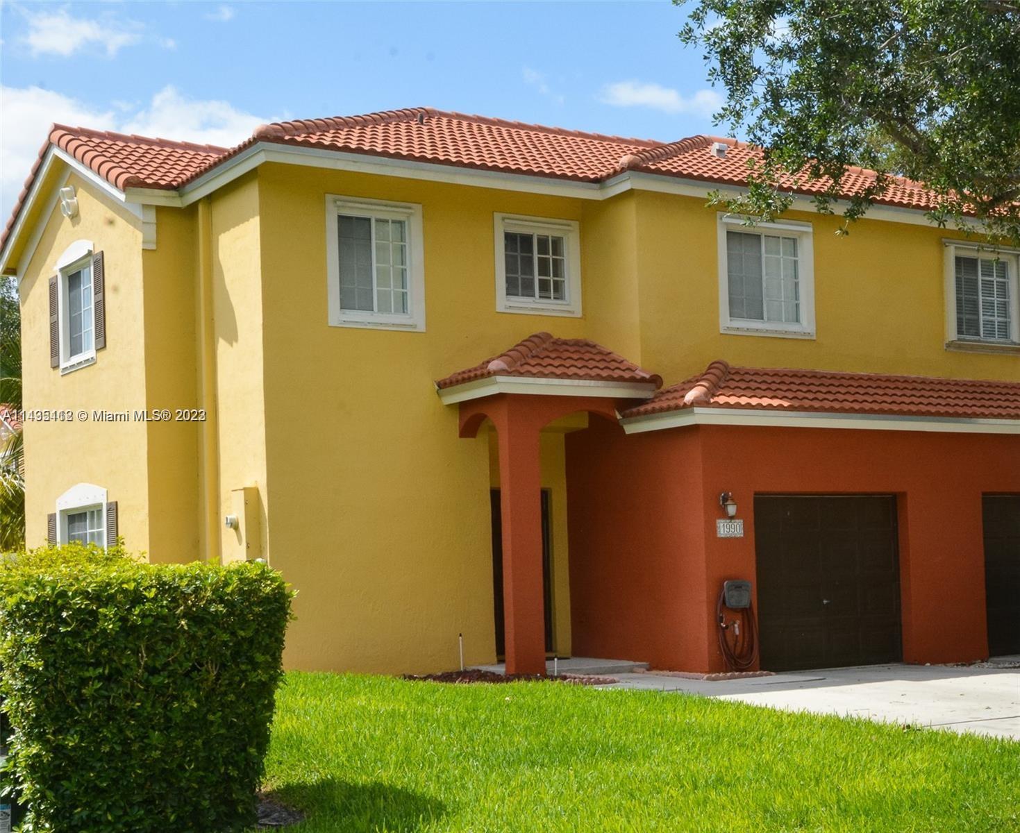 1990 Southwest 103rd Terrace Miramar, FL 33025 - Photo 1 of 19 a front view of a house