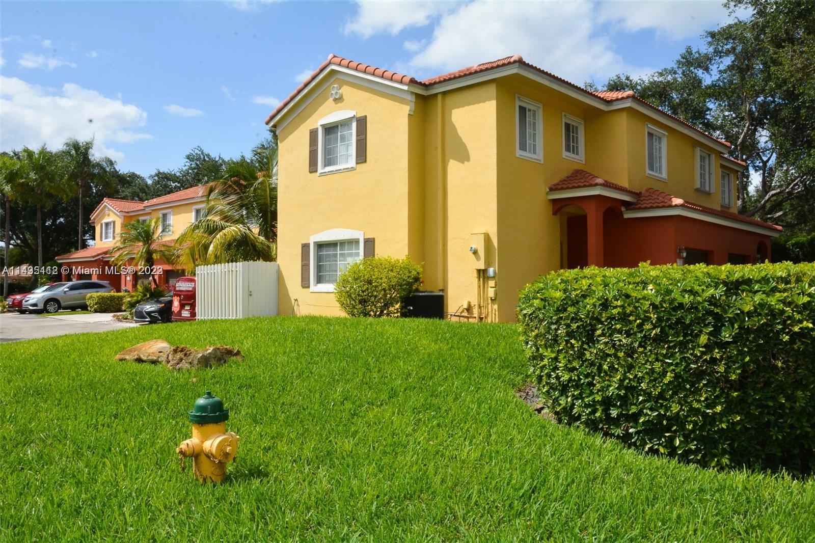 1990 Southwest 103rd Terrace Miramar, FL 33025 - Photo 4 of 19 a front view of a house with garden