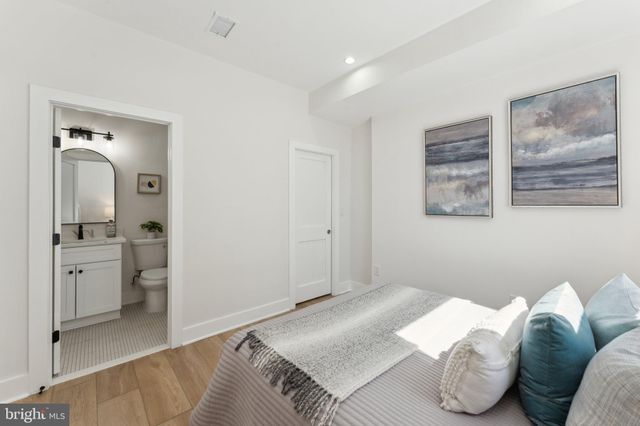 a bedroom with a bed and a couch